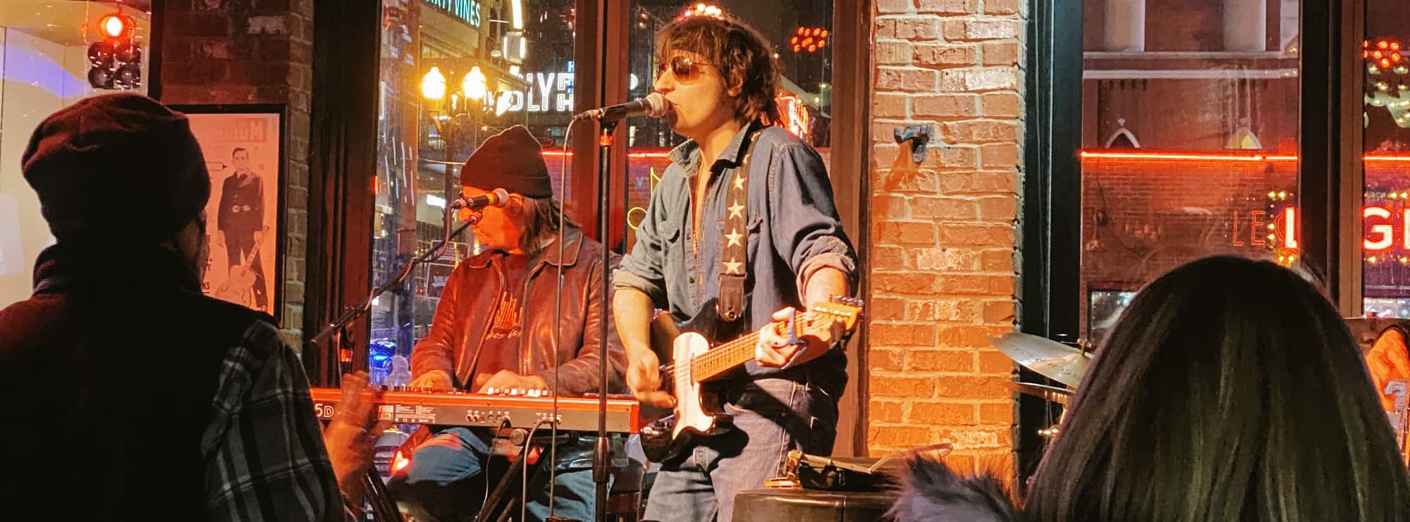 bar singer on guitar in Louisville